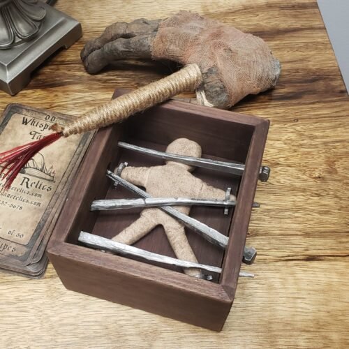 Caged Voodoo box on display with aged Arcane Relics cards